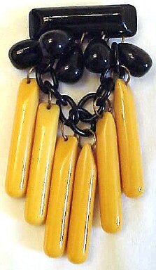 BP187 black & corn bakelite dangly pin